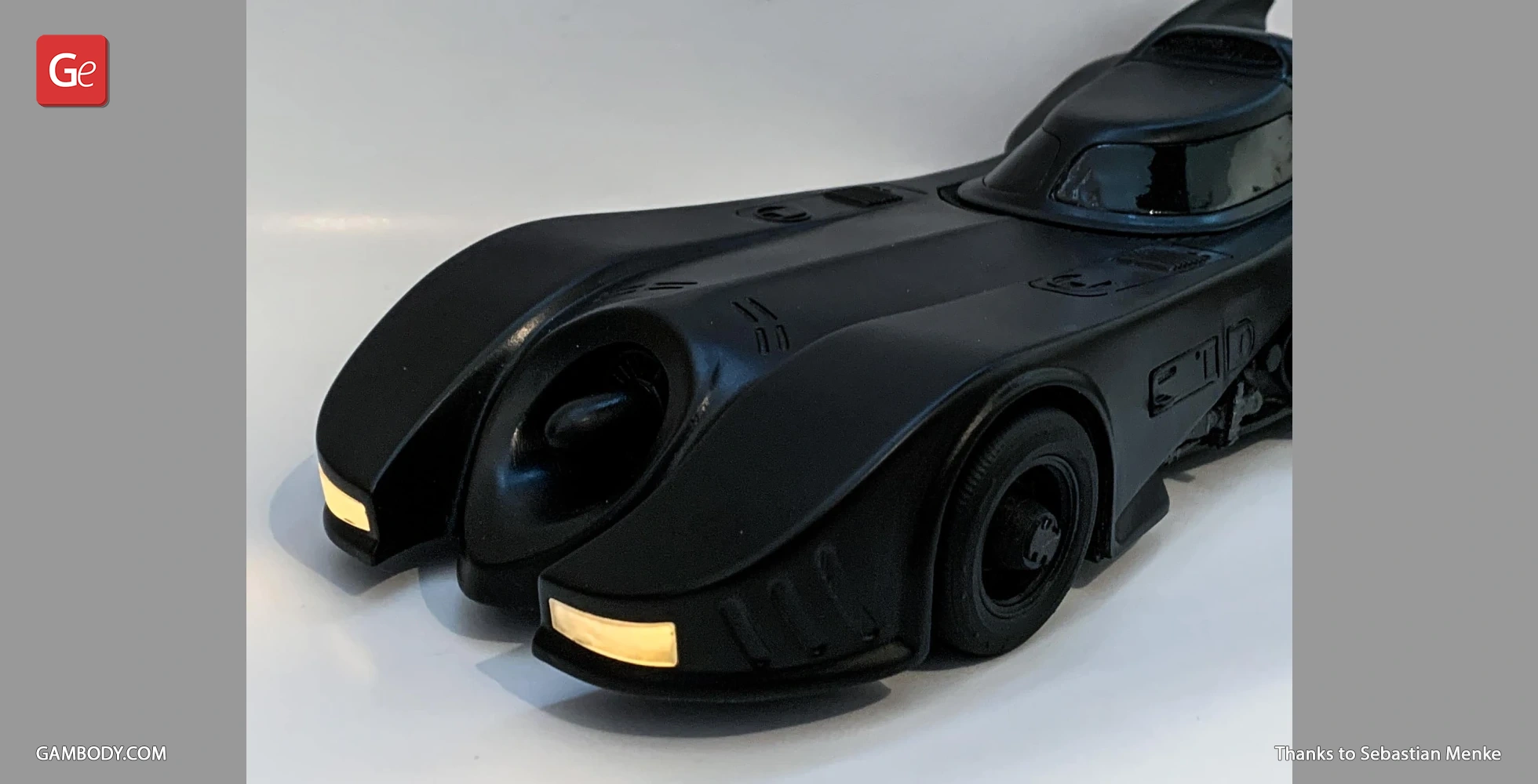 Sleek black 3D-printed Batmobile model from 1989, viewed from the front-left angle.