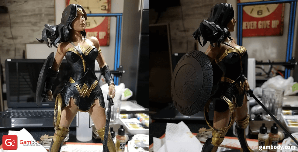 3D-printed Wonder Woman figurine with armor, shield, and sword, displayed on a table.