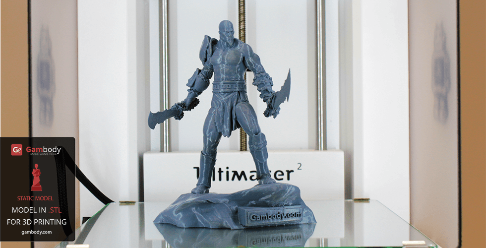 A 3D-printed figure of a muscular warrior holding blades, standing on a detailed rock base.