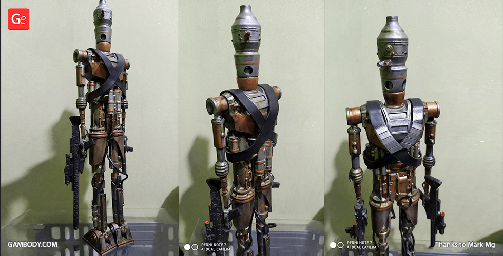 A detailed 3D-printed model of the IG-11 Droid from a sci-fi universe, with metallic and weathered features.